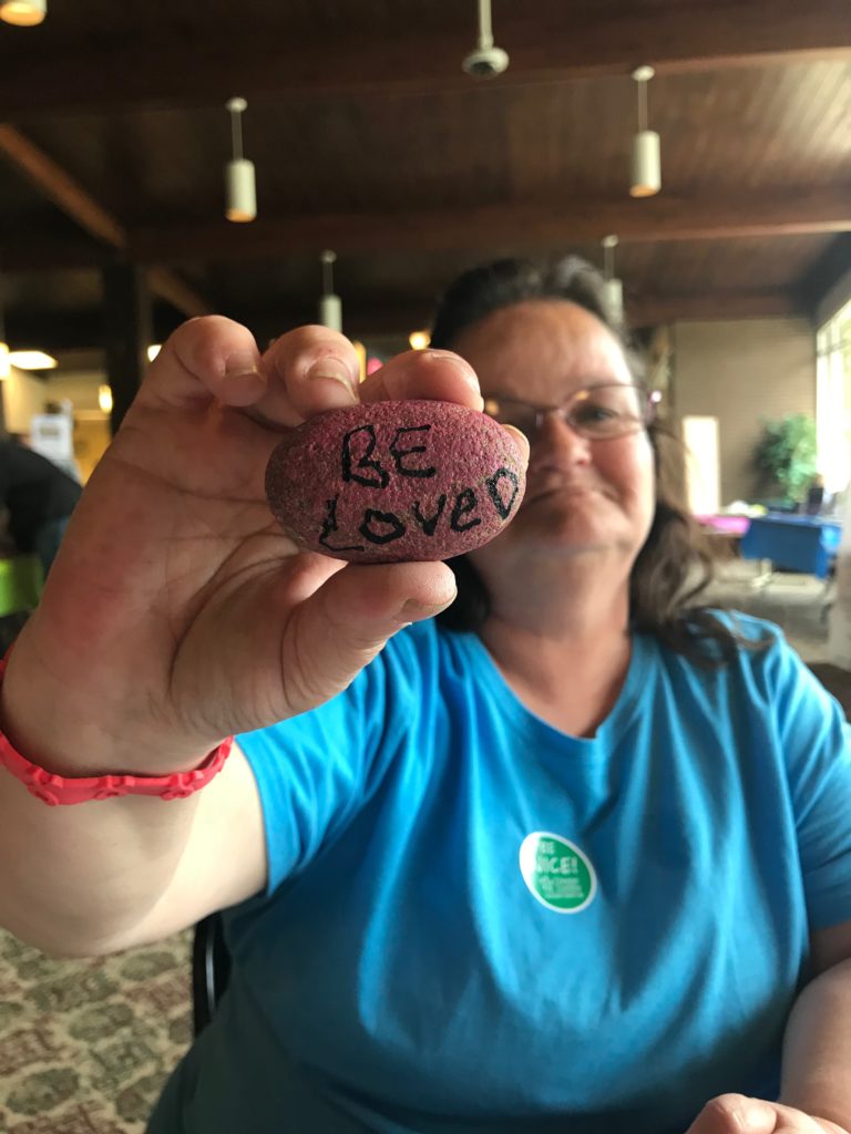 Kindness Rocks - Painted Rock held by painter